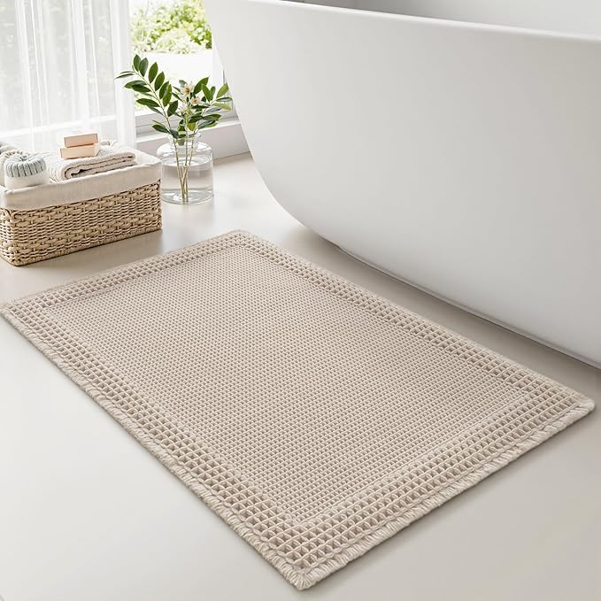 RESARE Waffle Bath Mat, Super Absorbent Non Slip, Machine Washable, Ultra Soft Boho Bath Rugs with Tassels, Upgraded Bordered Design, 17"x24" Pale Beige